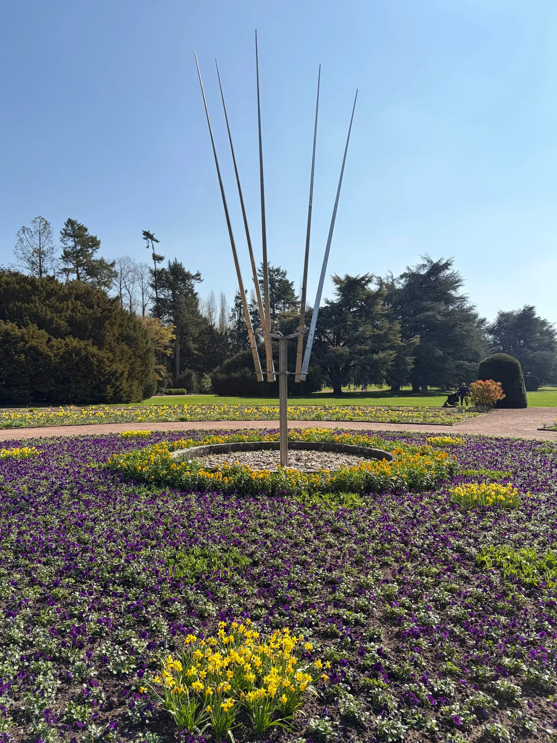 Kinetic sculpture and flower bed in Nordpark