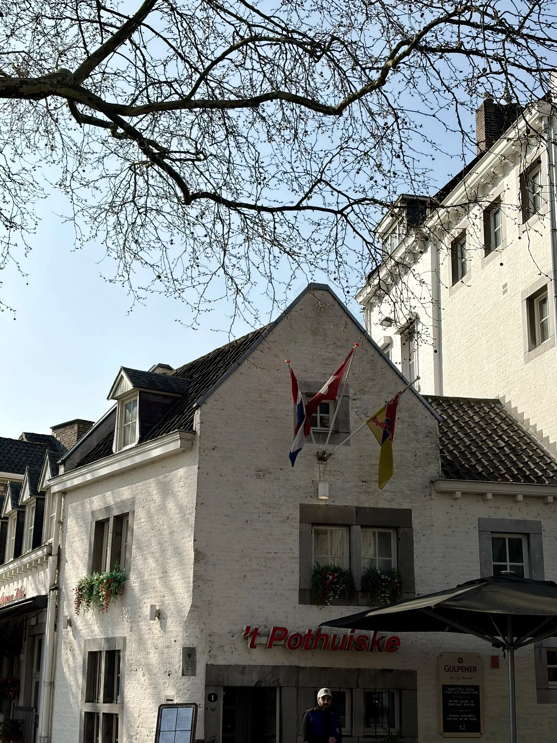 't Pothuiske café terrace with Maastricht and Limburg flags