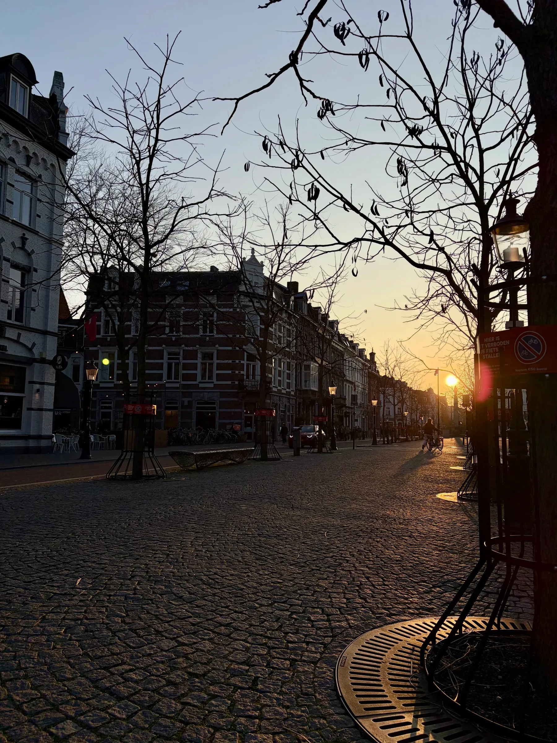 Corner buildings in warm evening light near the old centre