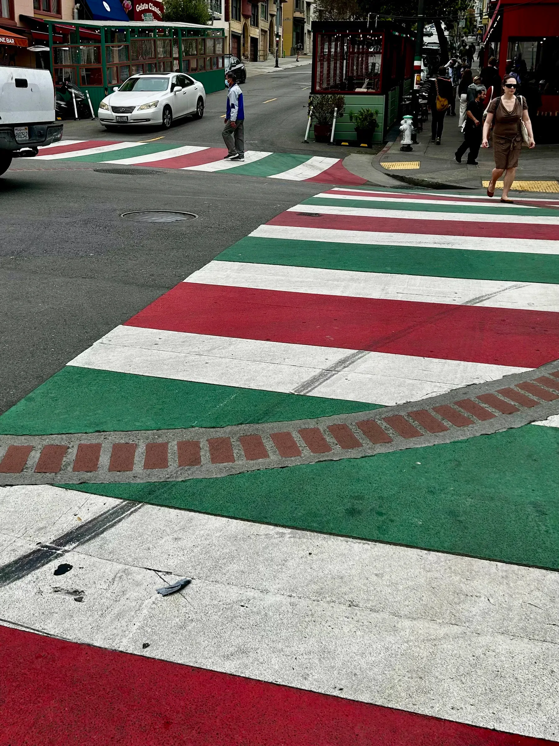Red, white, and green crosswalk detail in North Beach