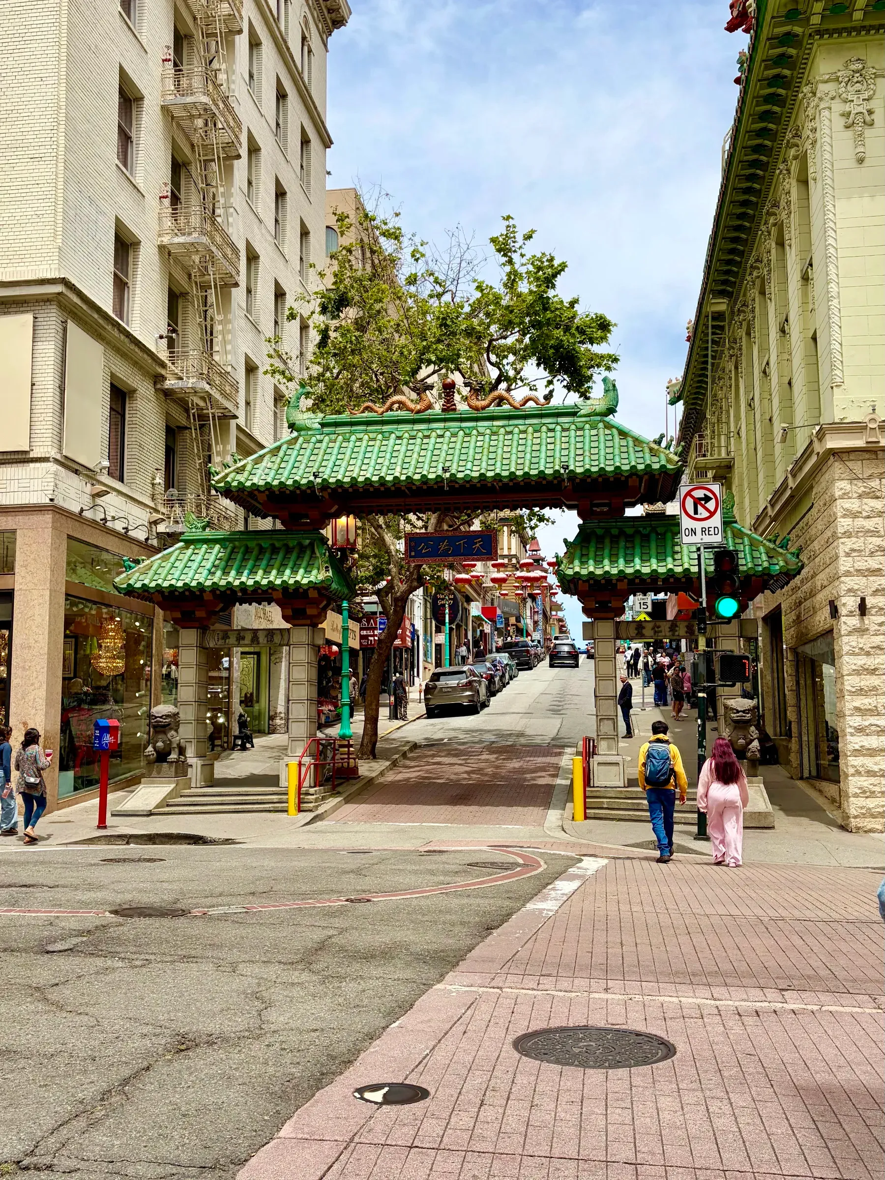 Ornate cast bronze dragon street lamp and lanterns against downtown buildings