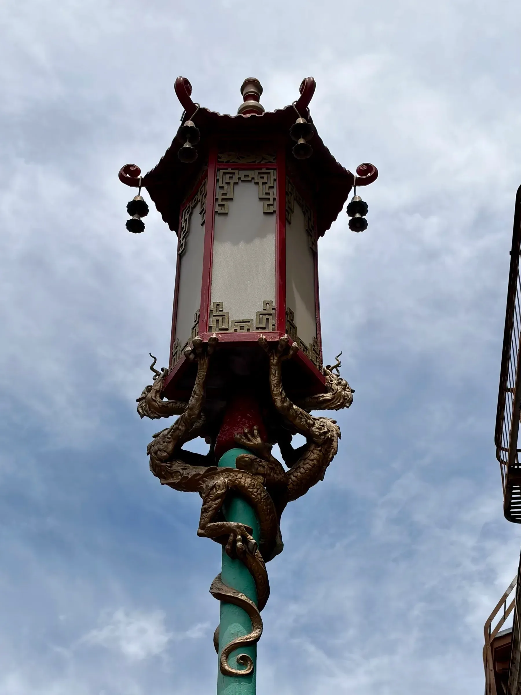 Cast bronze dragon street lamp detail along Grant Avenue