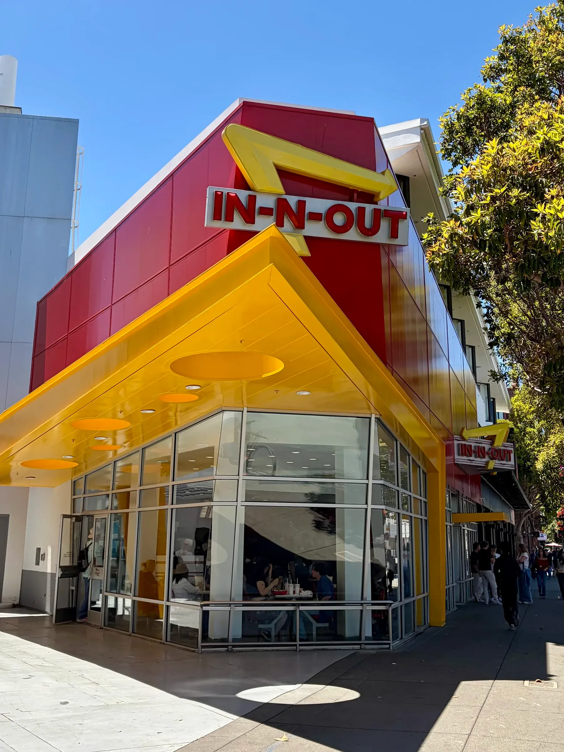 Iconic yellow neon sign at the Fisherman's Wharf In-N-Out Burger location