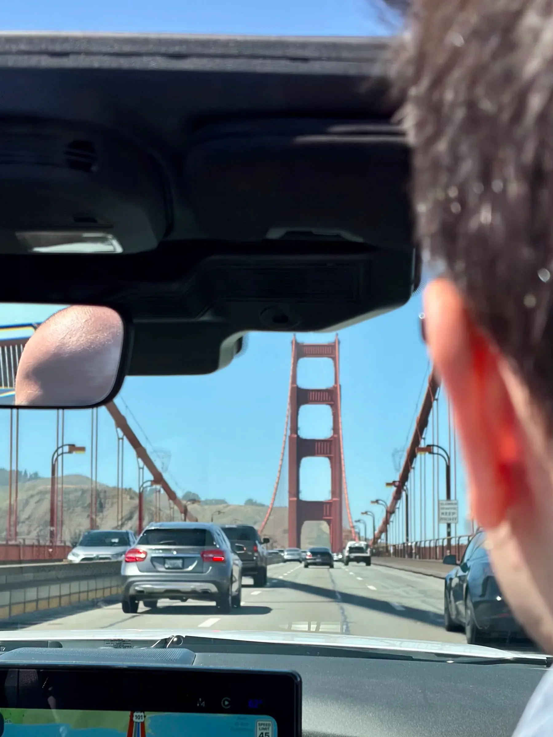 Driver perspective crossing the Golden Gate Bridge suspension cables
