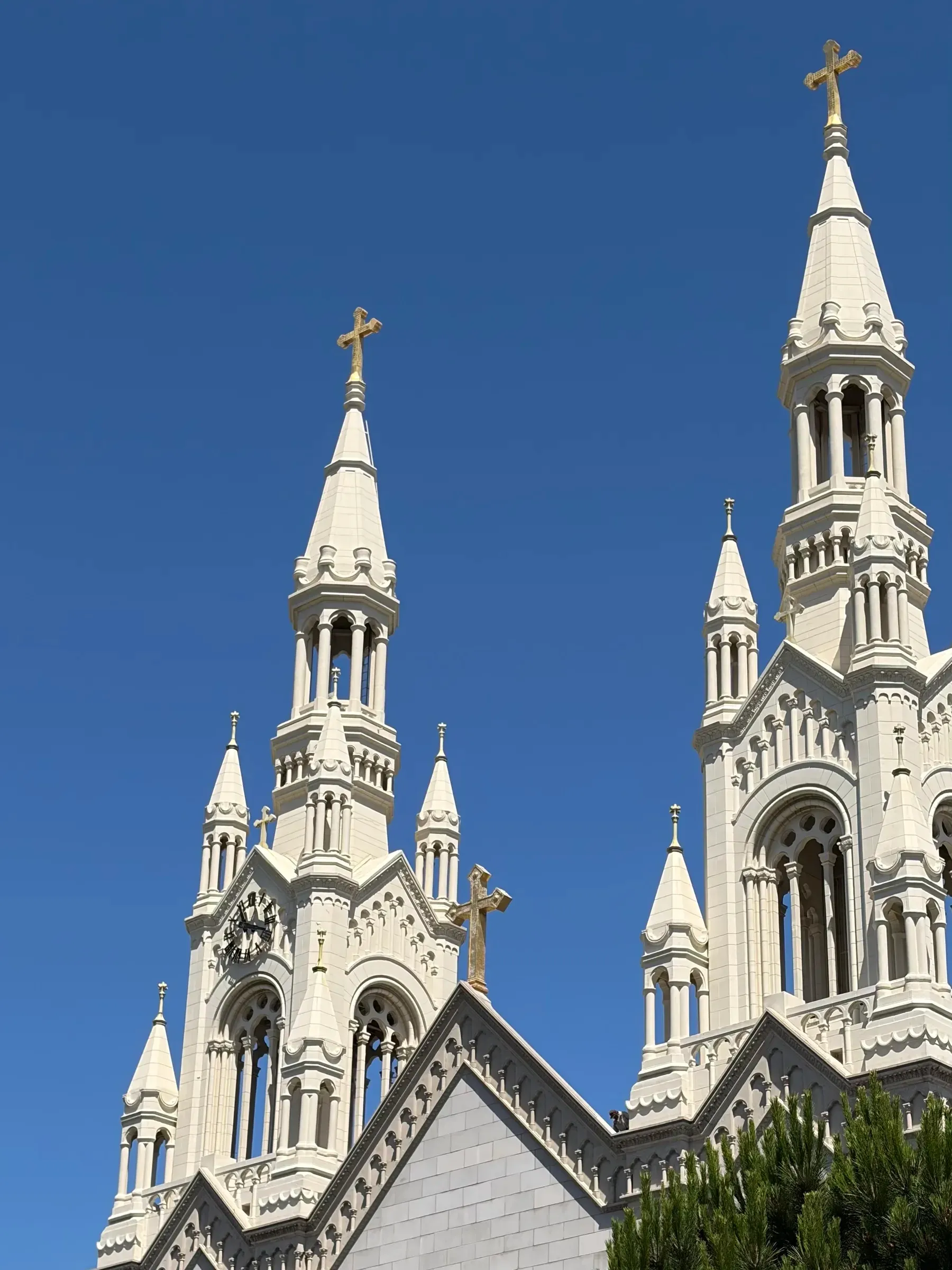 Twin spires of Saints Peter and Paul Church towering over Washington Square Park