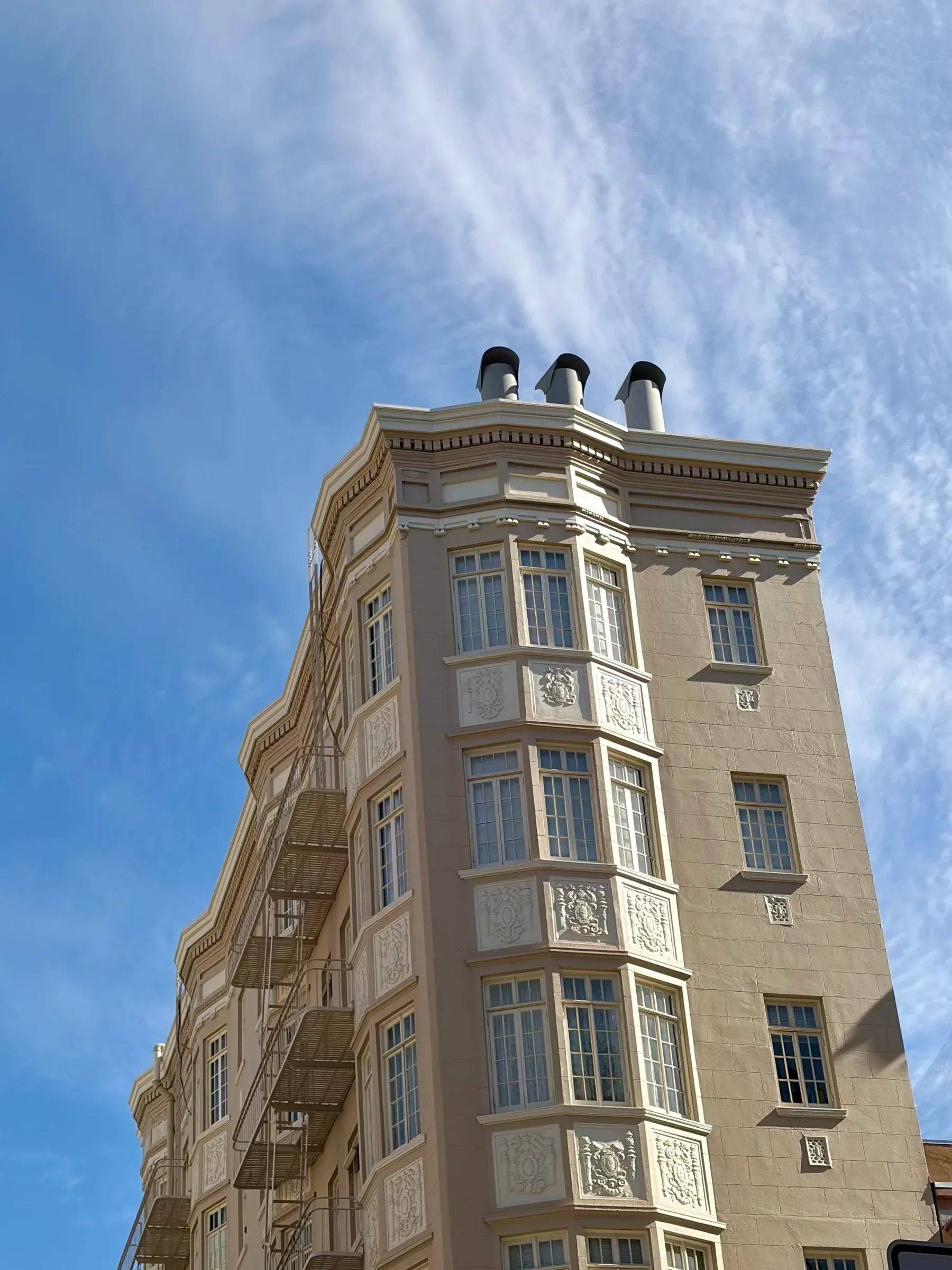 Black-and-white architectural detail of classic Victorian bay windows
