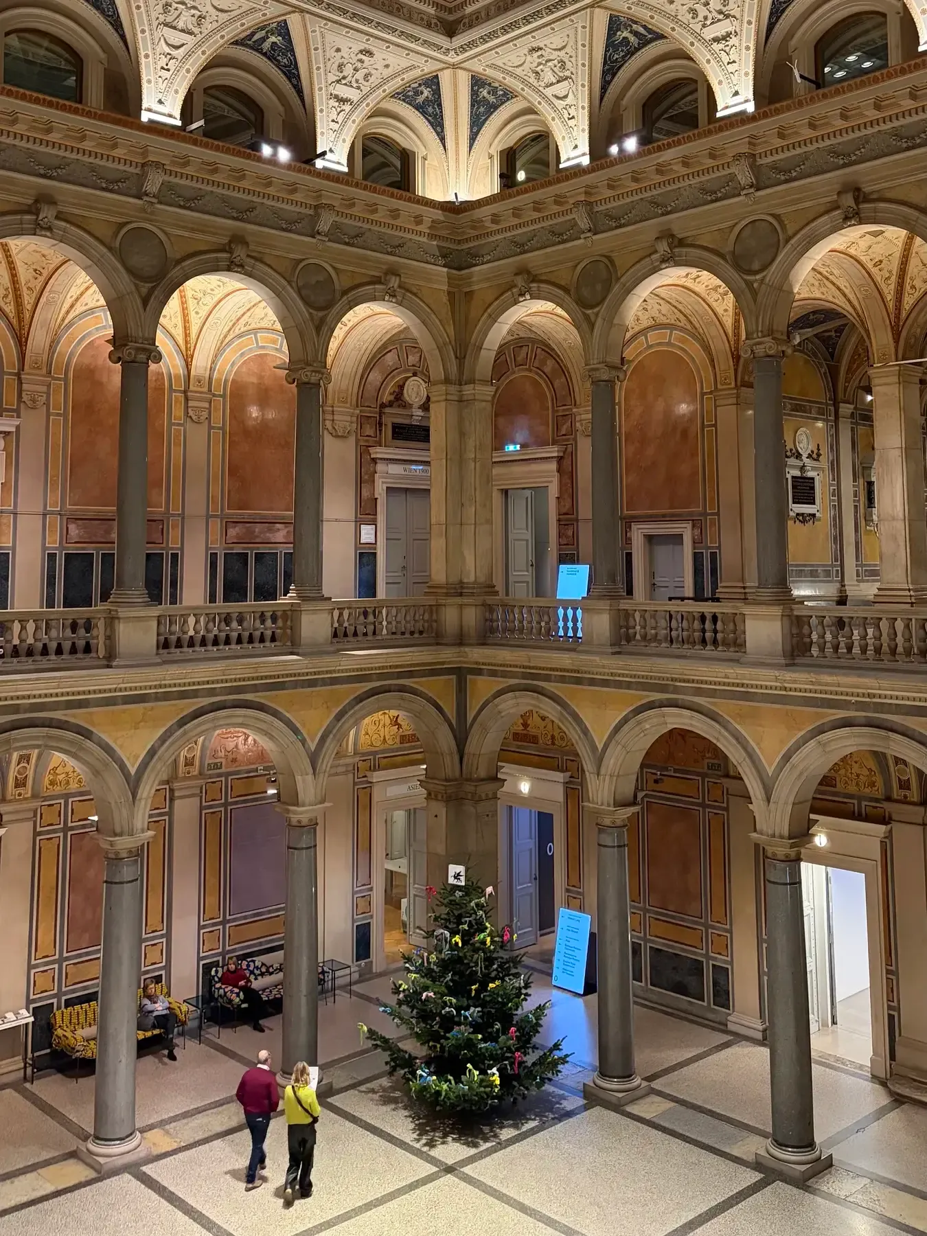 Arcaded MAK museum courtyard with a Christmas tree