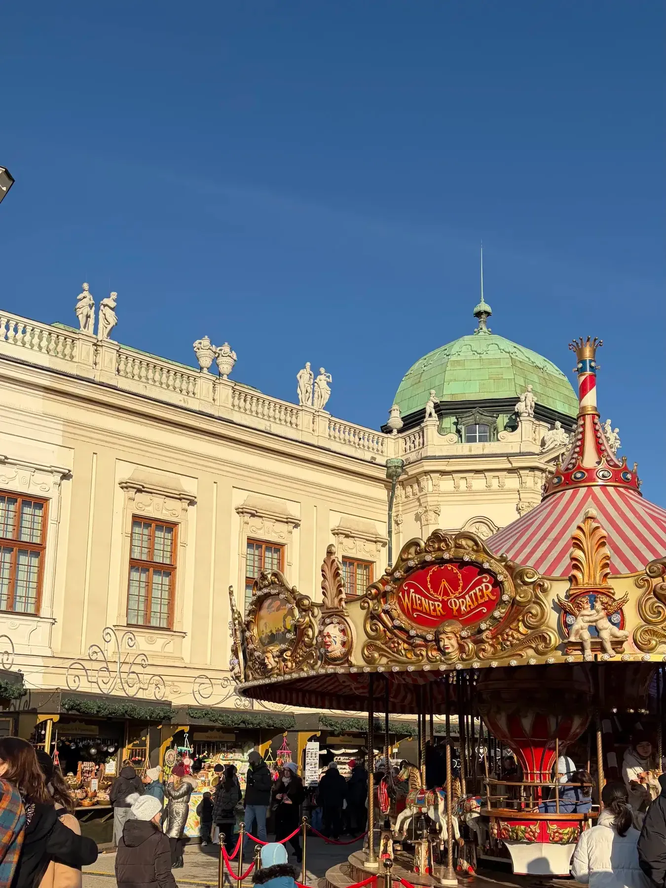 Carousel in front of the Upper Belvedere at the Christmas market