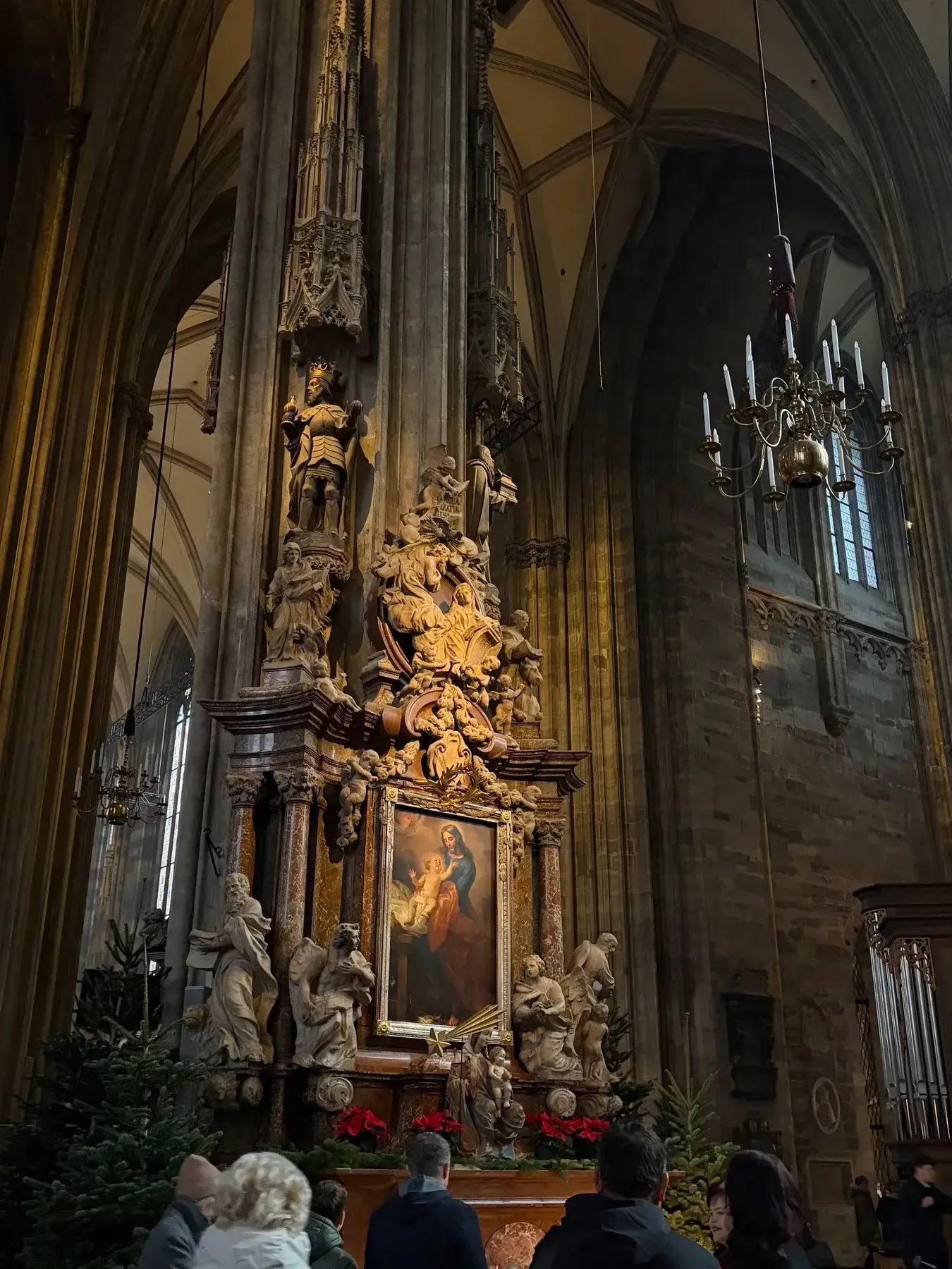 Stone pulpit and side altar inside Stephansdom